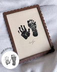 Framed hand and footprints with 'Evelyn' signature on a textured surface