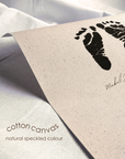 Cotton canvas with black footprints and text on a light background