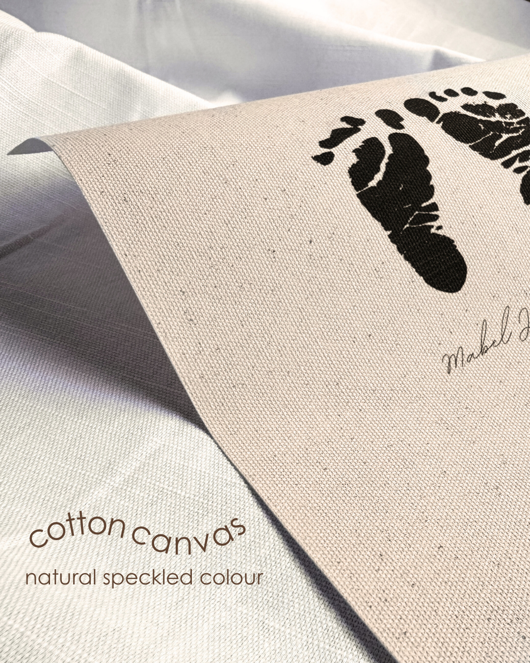 Cotton canvas with black footprints and text on a light background
