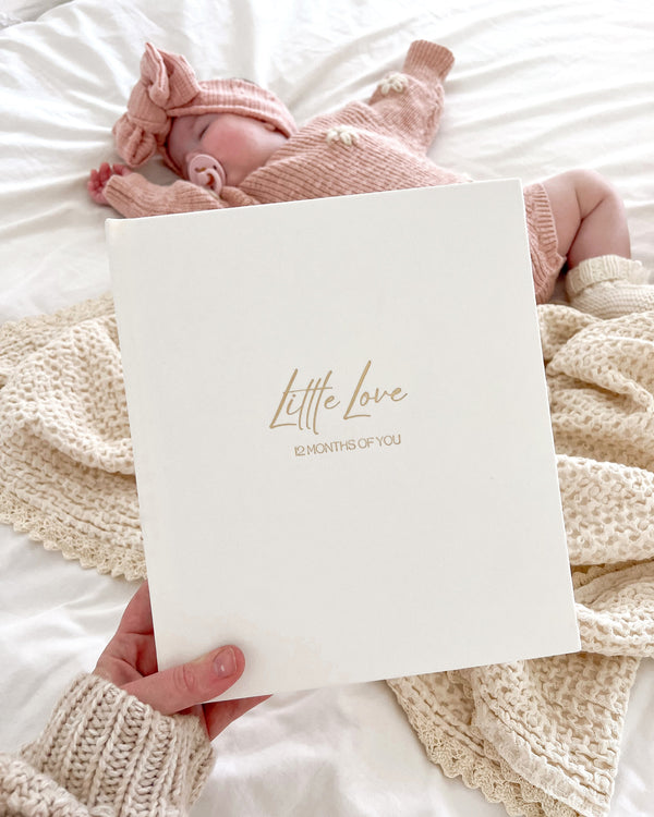 12-month baby photo album with space for hand and footprints, photos, and milestone cards – gold foil linen cover